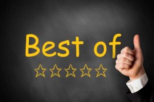 Thumbs up in front of a black chalkboard listing "best of" with golden rating stars for Cannabis Industry behind it. Medical Marijuana Packaging & Dispensary Supplies