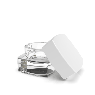 Clear marijuana concentrate container with white lid from Green Rush Packaging.